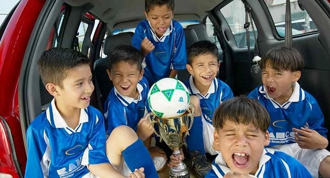 Children celebrating a soccer tournament victory